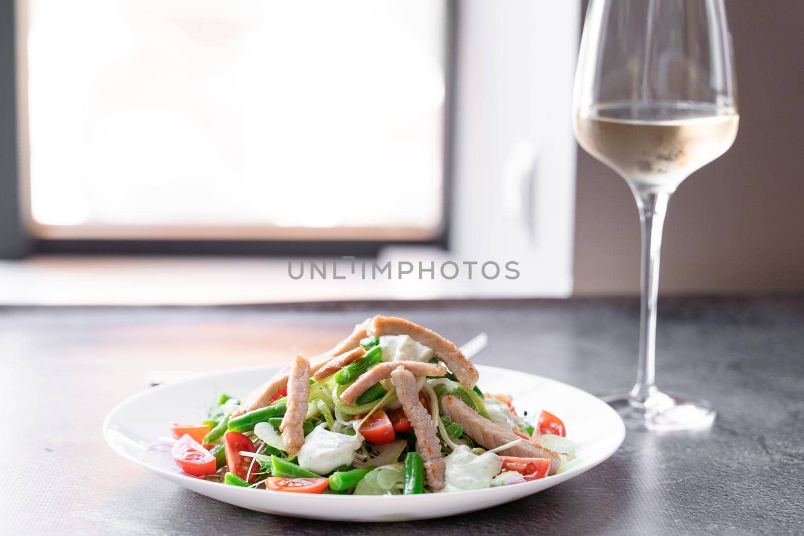 Caesar salad with chicken and parmesan, cherry tomato, lettuce, croutons and egg. by Rabizo