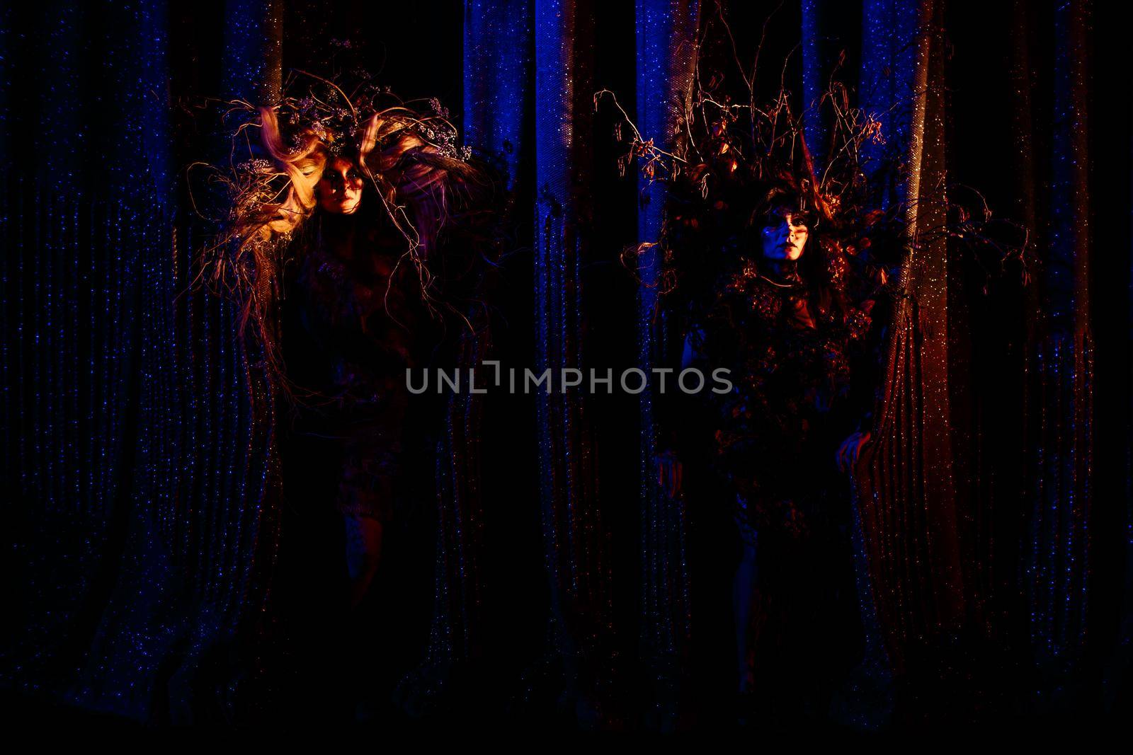 Ghost girls, spirits of the theater, looking out from behind the scenes of the theater by deandy