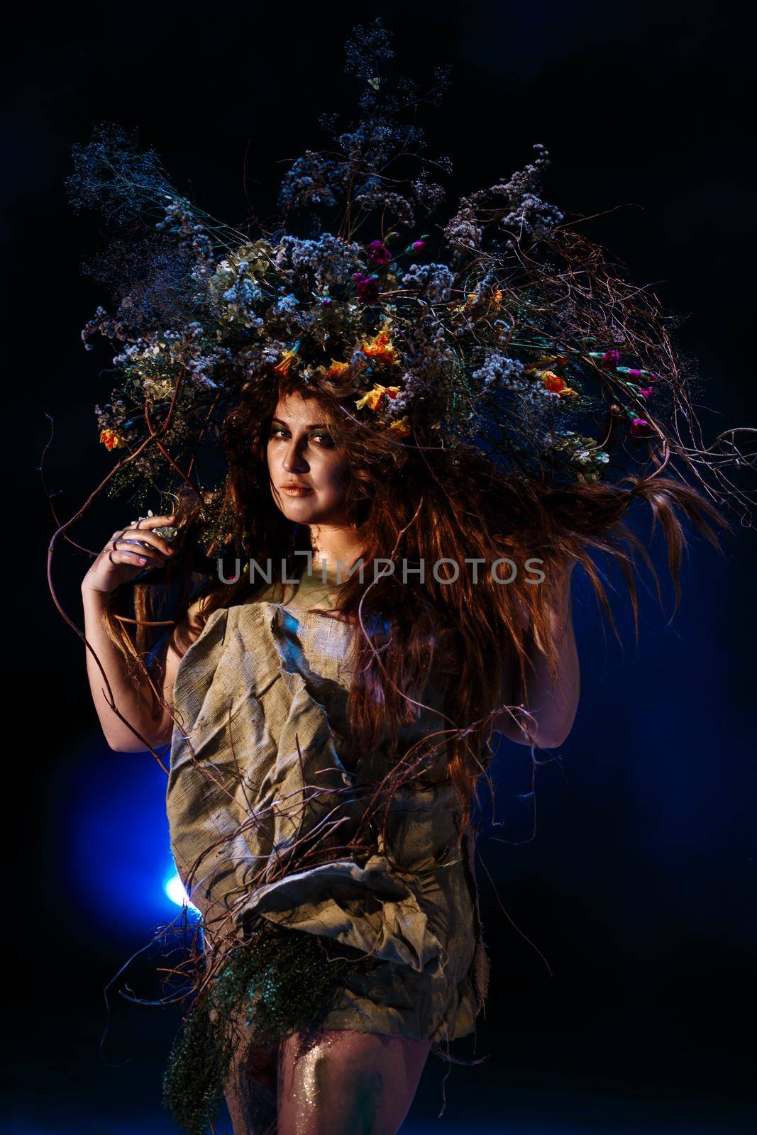 Dryad, Muse from the forest, standing in blue light and smoke