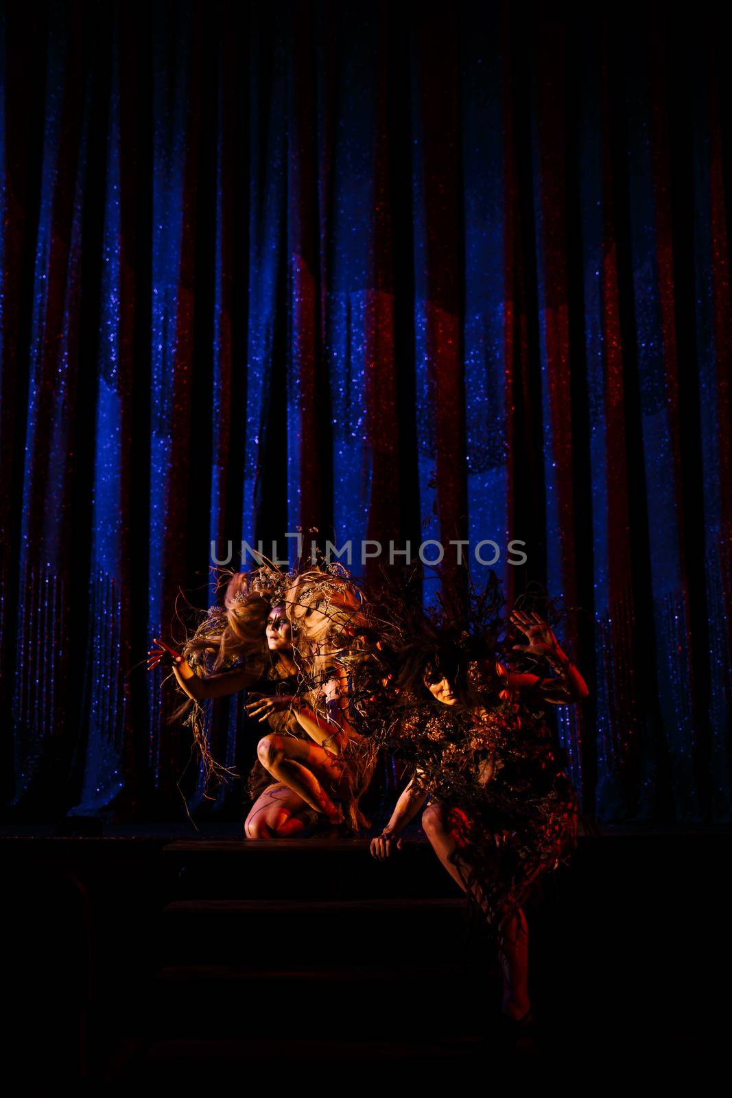 Ghost girls, spirits of the theater, before the scenes on the stage of the theater.