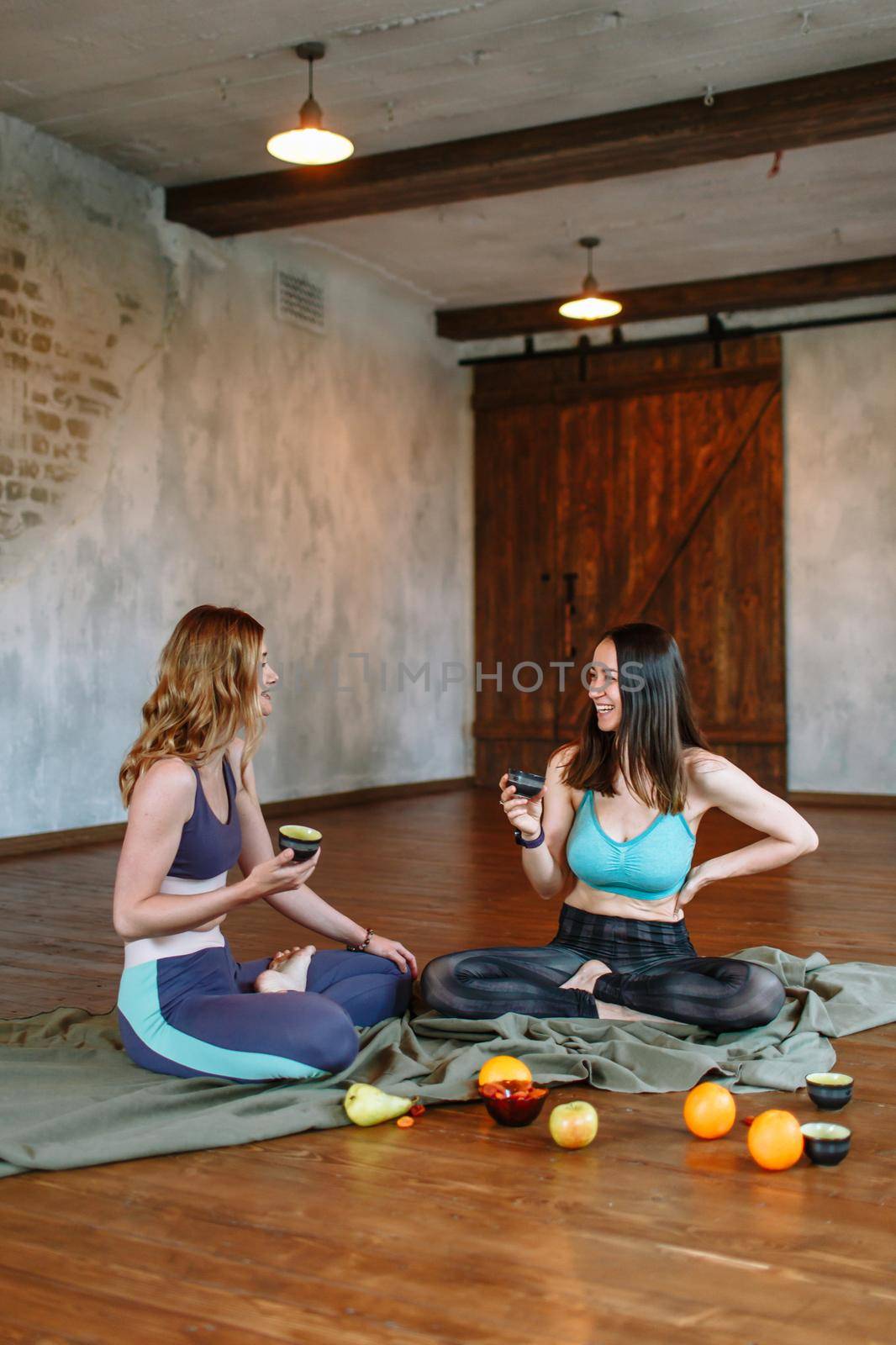 Conversation and tea party of two yogis in the loft