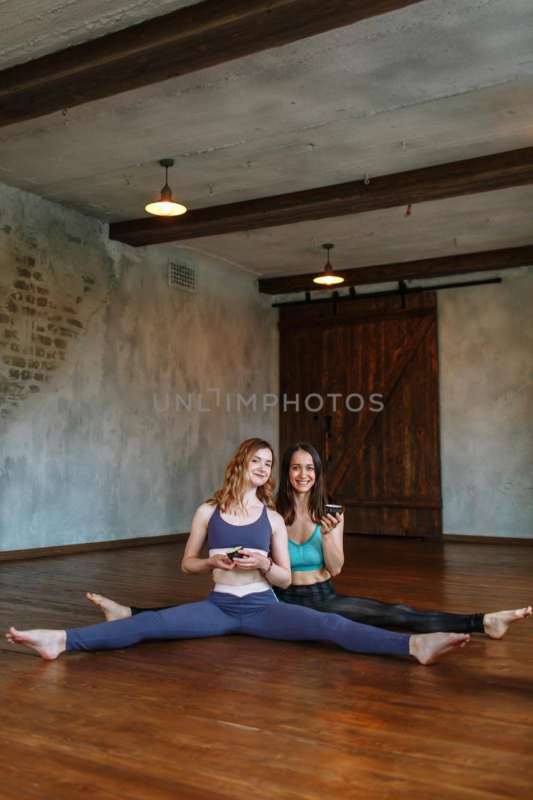 Conversation and tea party of two yogis in the loft