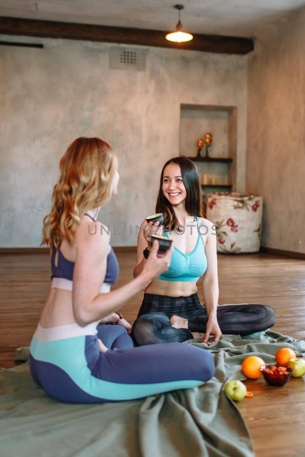 Conversation and tea party of yogis in the loft by deandy
