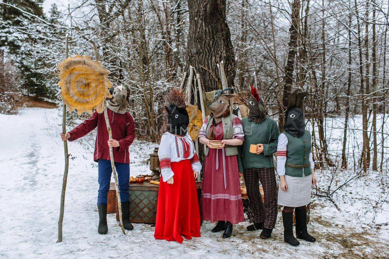 People in national costumes with animal heads celebrate the arrival of the pagan holiday Maslenitsa. An ancient pag by deandy