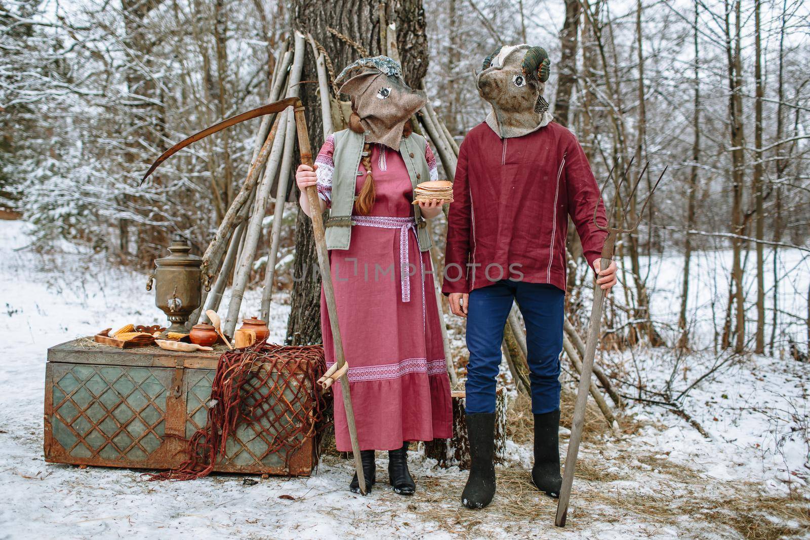 People in national costumes with animal heads celebrate the arrival of the pagan holiday Maslenitsa.