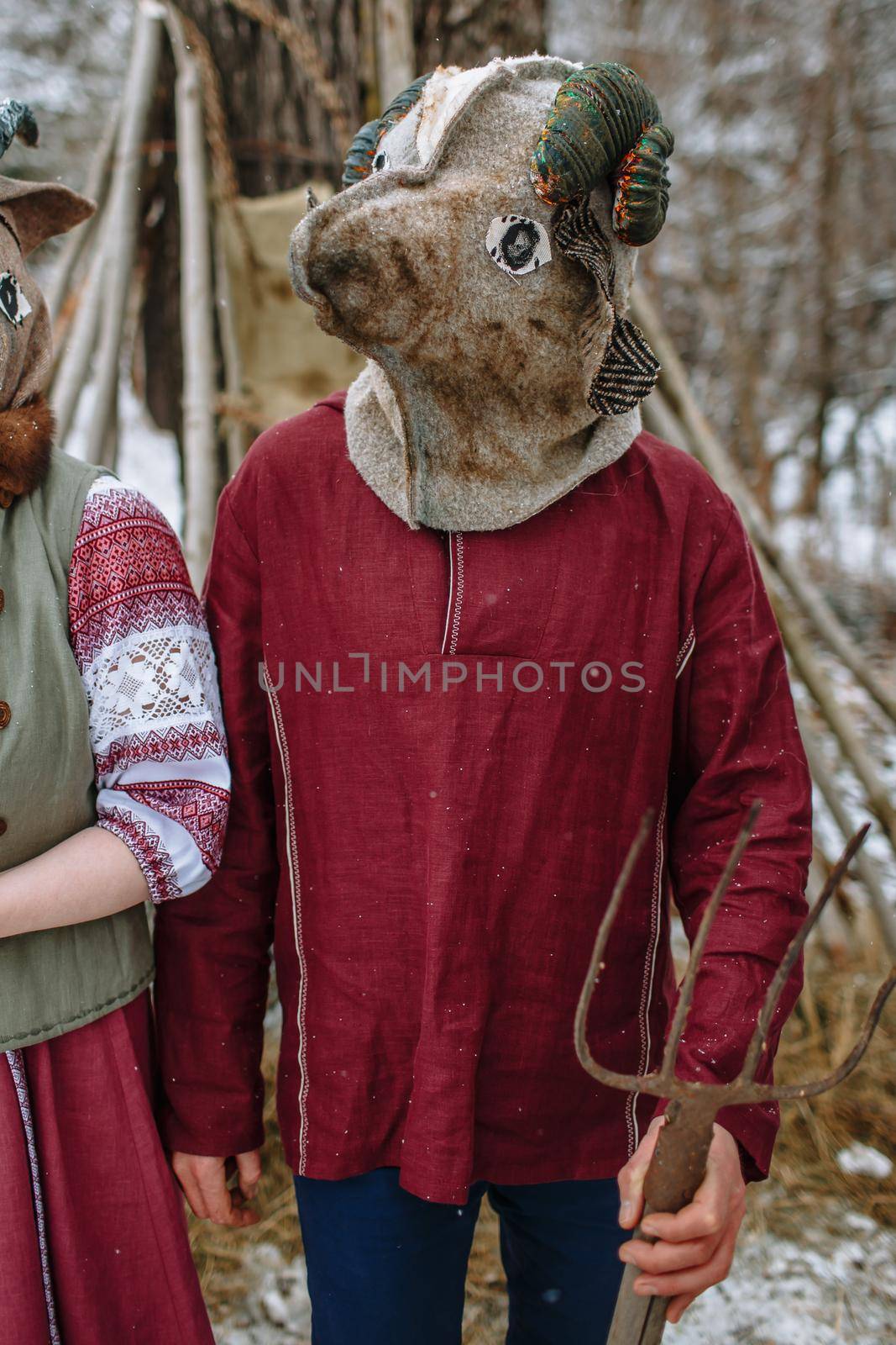 A man in a national costume with the head of an animal celebrates the arrival of the pagan holiday Maslenitsa. An ancient pagan rite by deandy