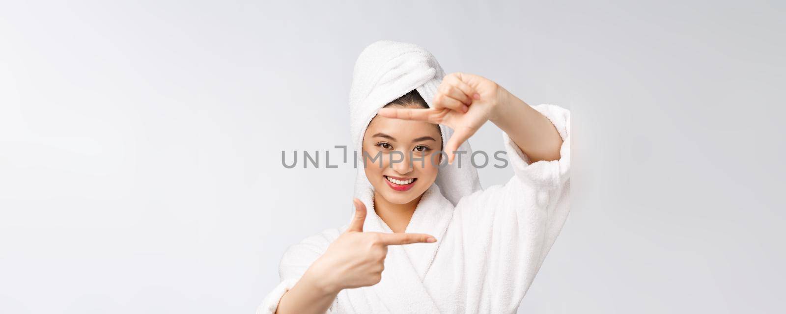 Beautiful Woman face and she making frame with hands with health skin, concept for skin care , asian beauty. by Benzoix