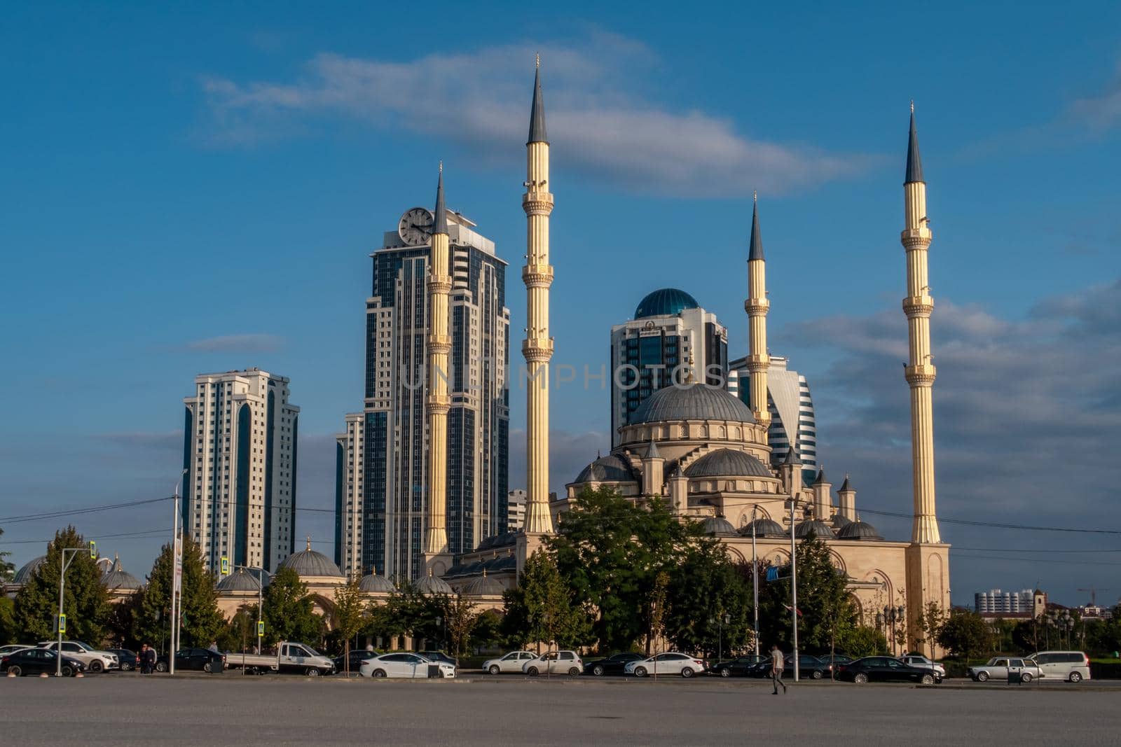 Russia, Chechen Republic city of Grozny. View to the mosque the heart of Chechnya and the skyscrapers of Grozny City at sunset. High quality photo