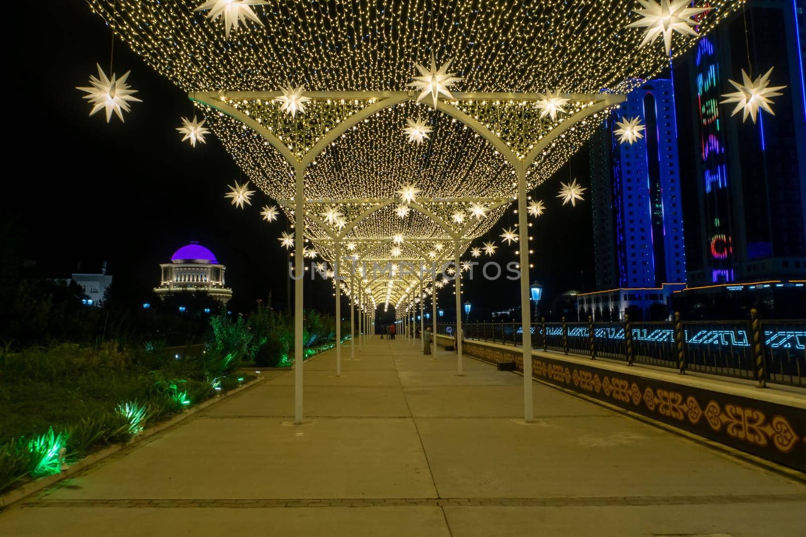 Russia, the Chechen Republic, Chechnya, the city of Grozny. Night landscape shot in the city center near the skyscrapers of Grozny City. Star gallery with illumination. High quality photo