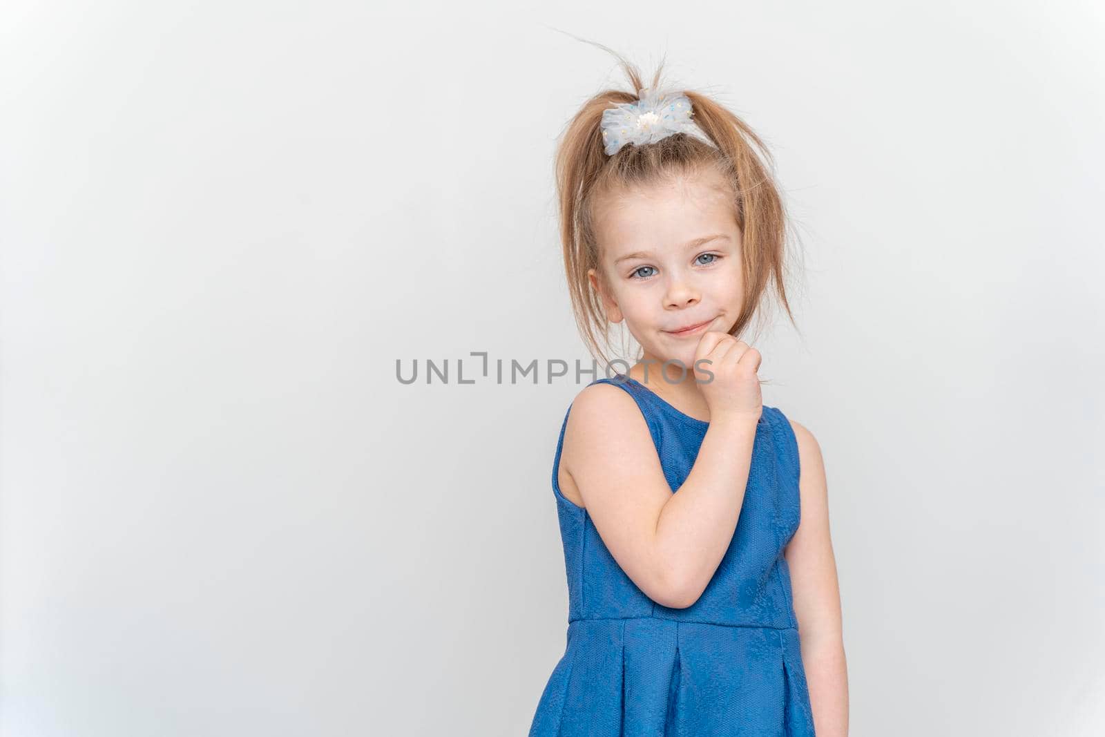 portrait of a cute 5 year old girl on a light background by Lena_Ogurtsova