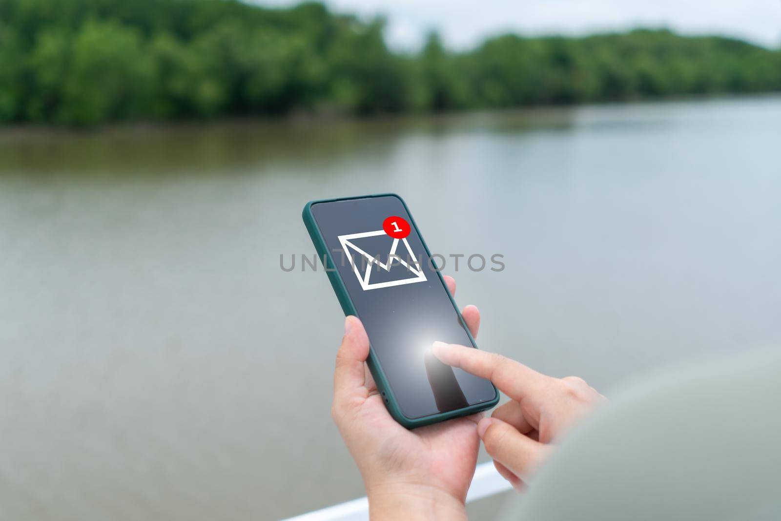 Woman hand using smartphone to send and recieve email. Business communication  technology concept.