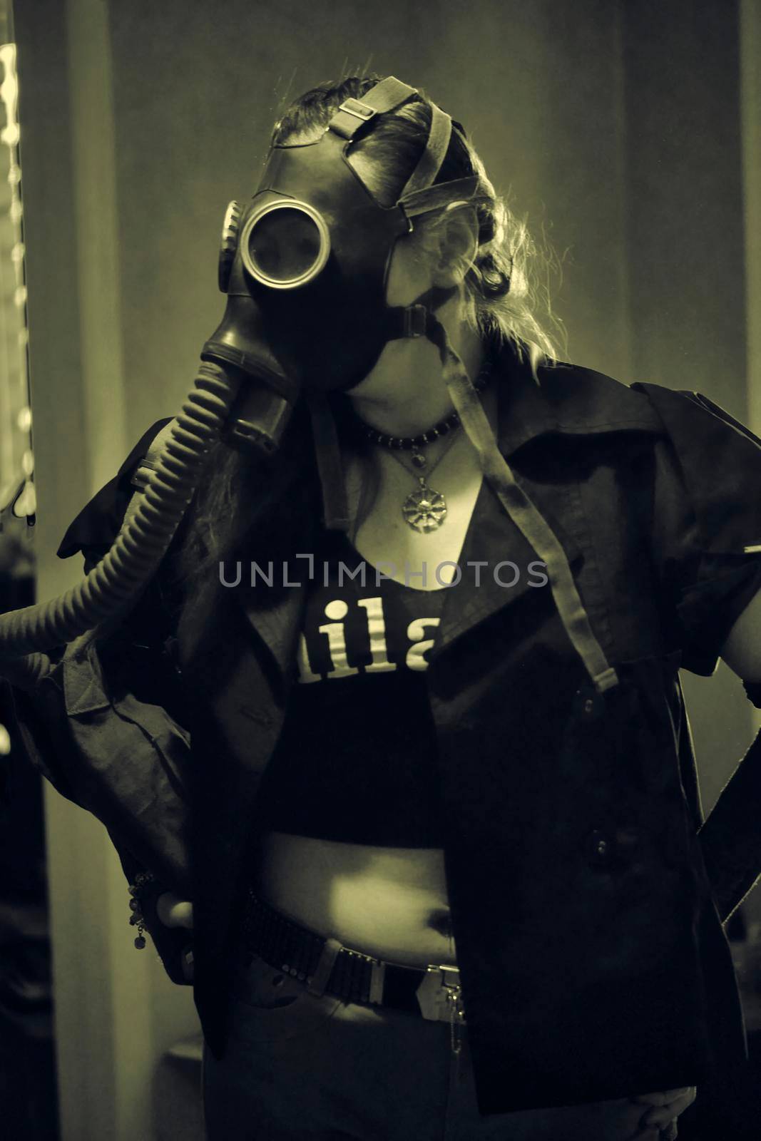 girl in a gas mask with a hose sepia by lempro