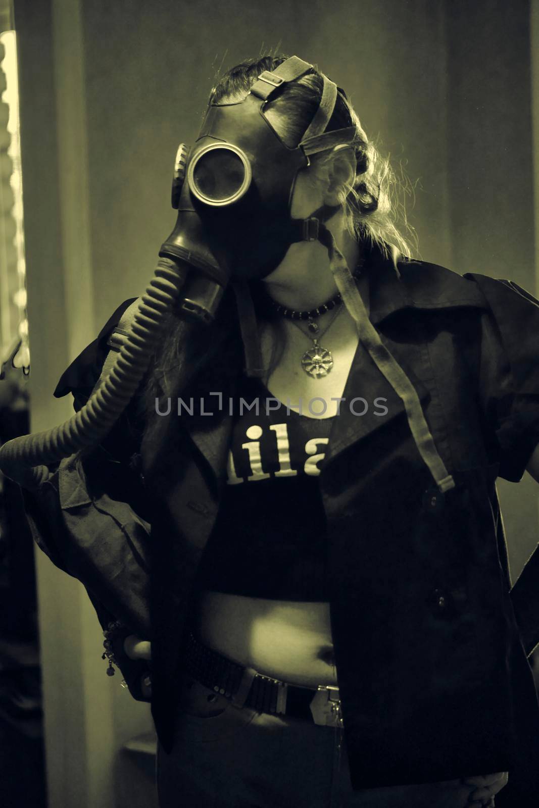 girl in a gas mask with a hose sepia by lempro