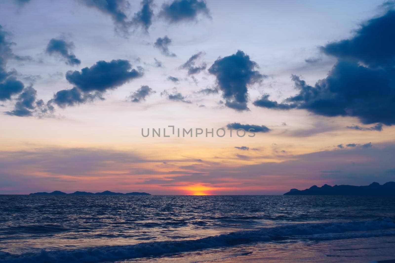 Tropical nature clean beach sunset sky time with sun light. by Suwant