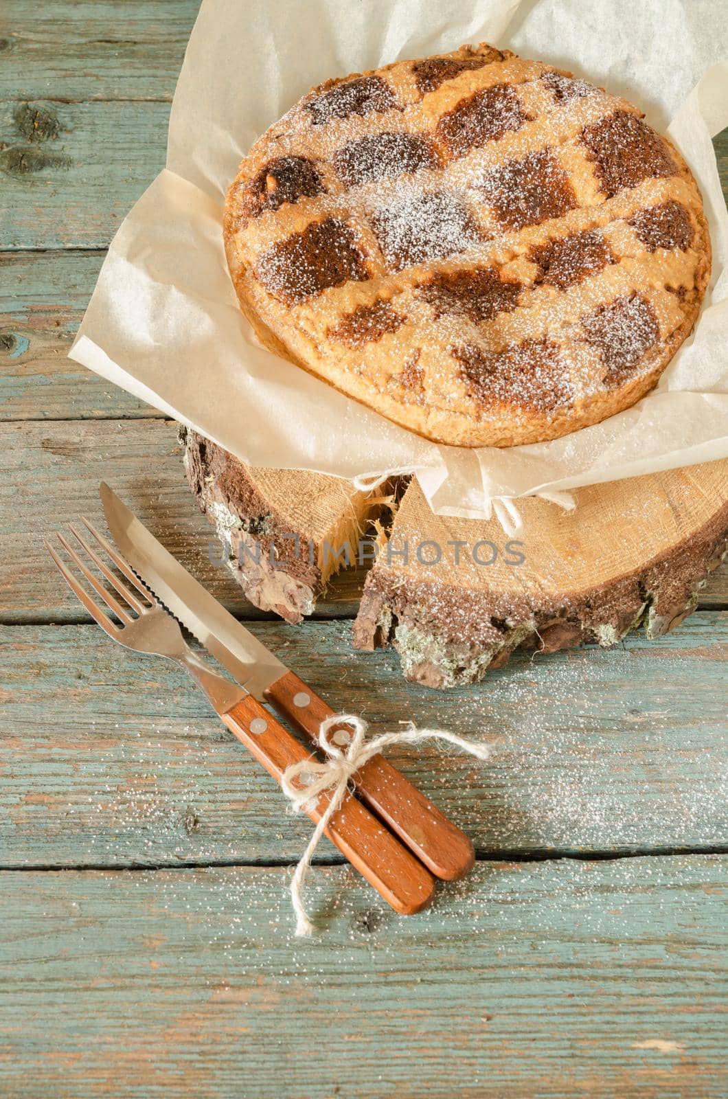 Neapolitan pie with wheat and ricotta on wooden table by zimages