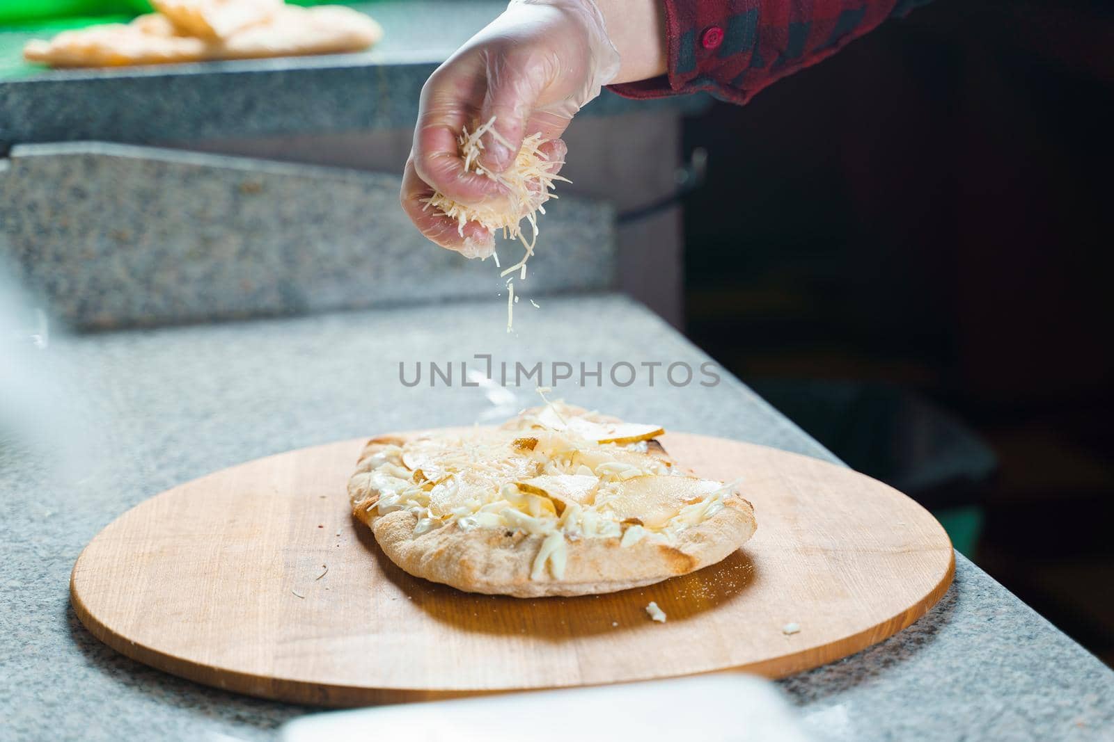 Dough for pinsa romana with cheese sauce. Scrocchiarella gourmet italian cuisine. Traditional dish