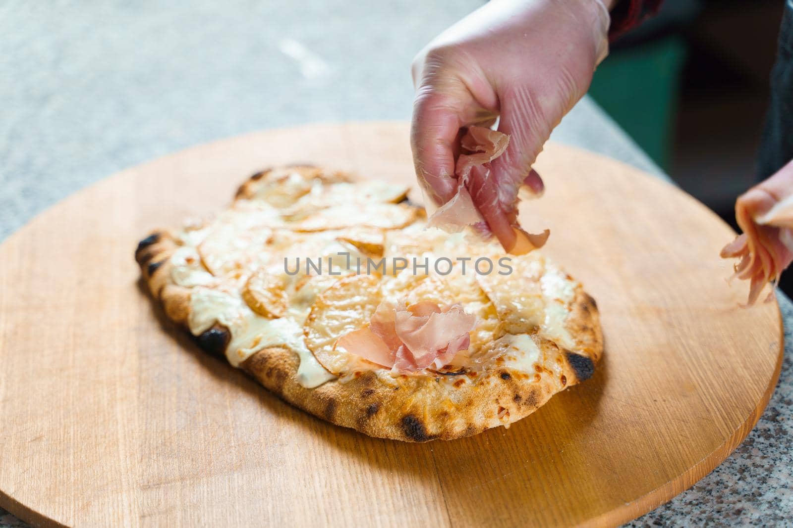 Dough for pinsa romana with cheese sauce. Scrocchiarella gourmet italian cuisine. Traditional dish