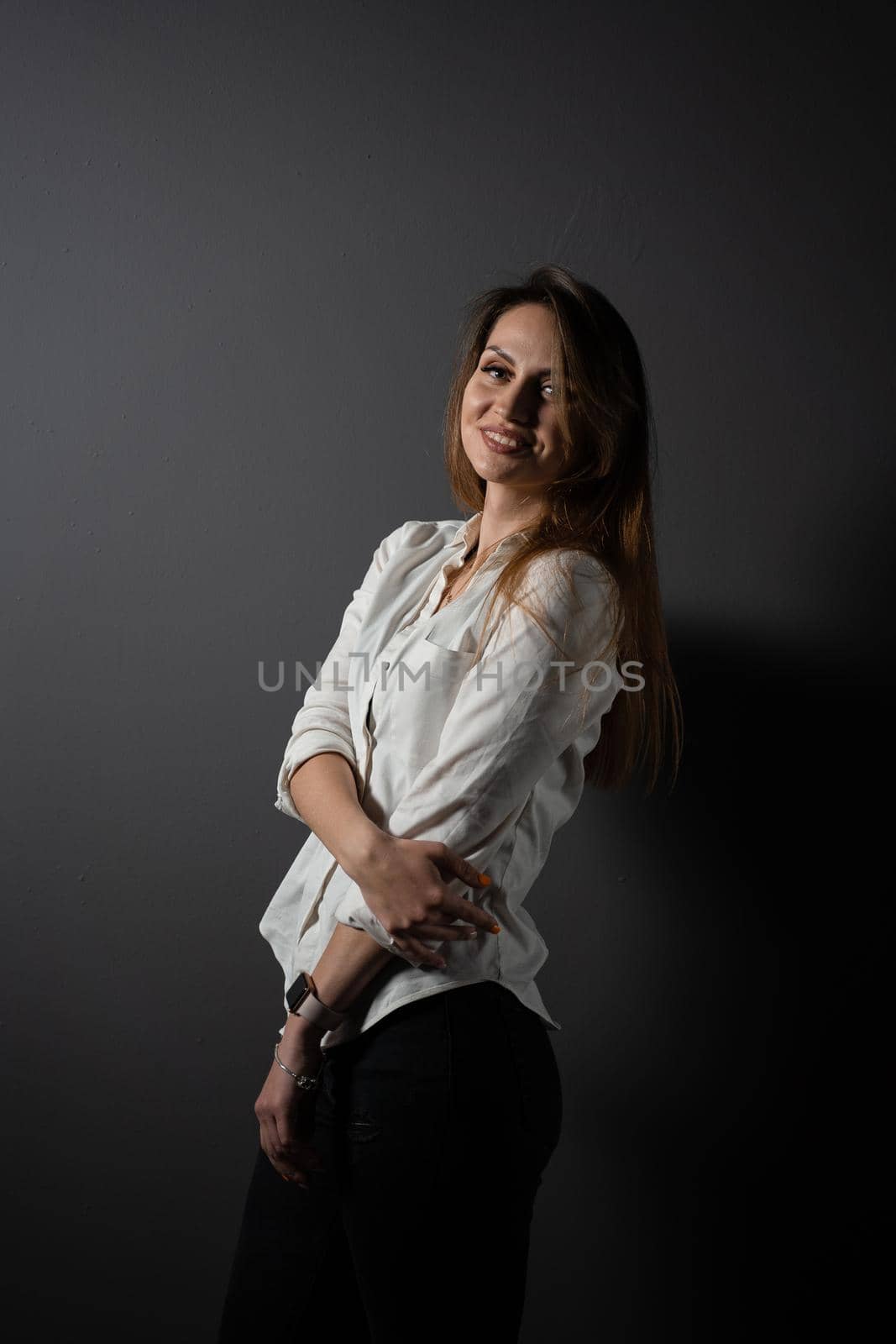 Business woman portrait on black background. Confident model posing. Lifestyle