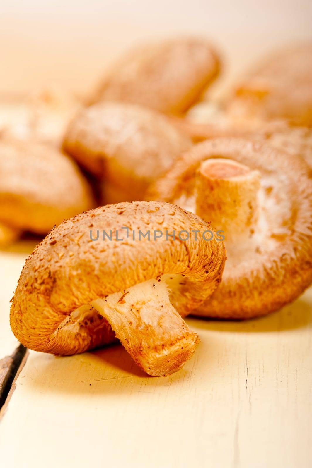 fresh shiitake mushrooms on a rustic wood table 