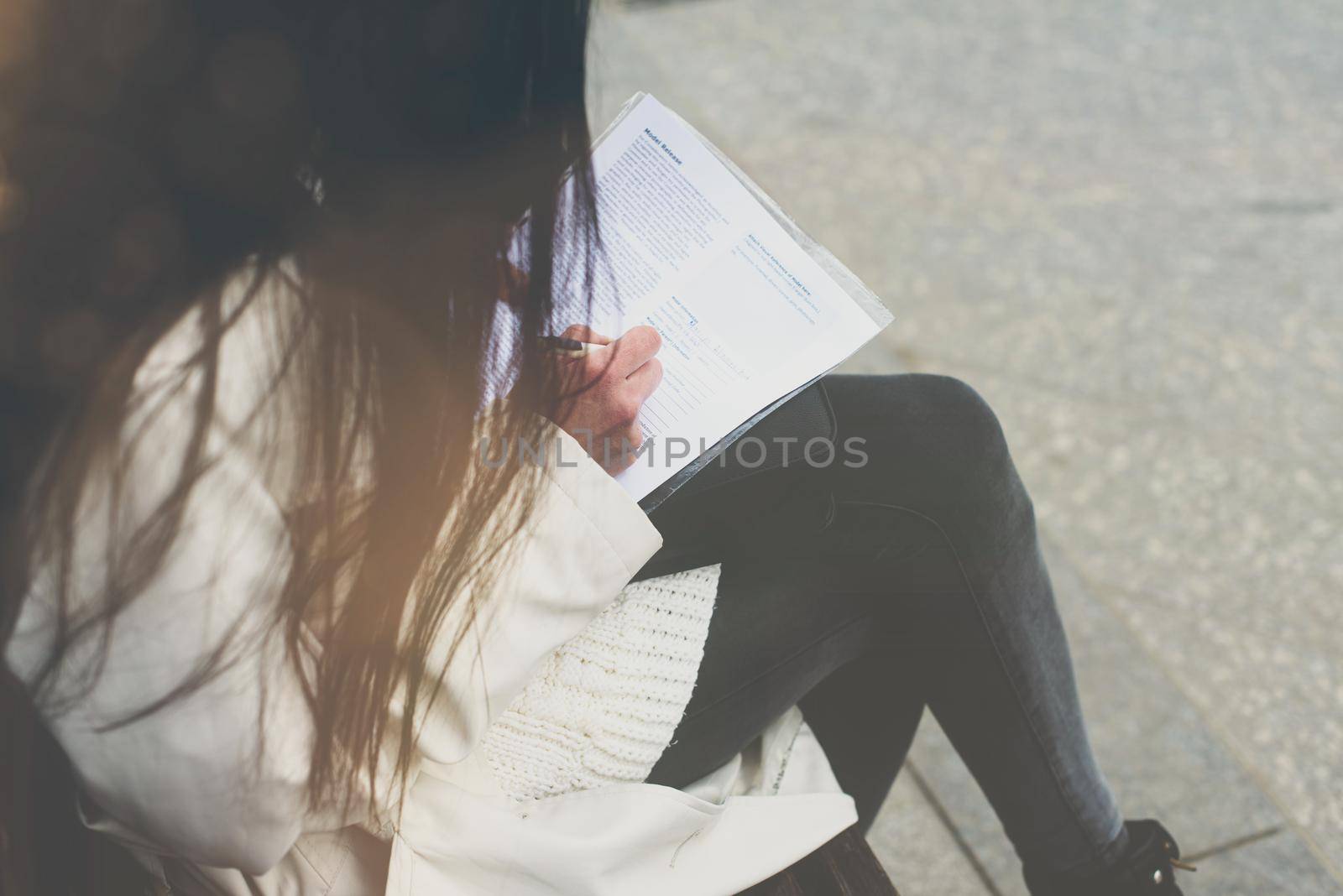 SME Businesswoman's hand with pen completing personal information on form by Ashtray25