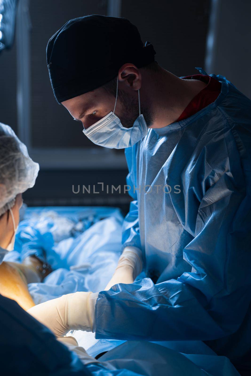 Vascular surgeon removing veins from the leg