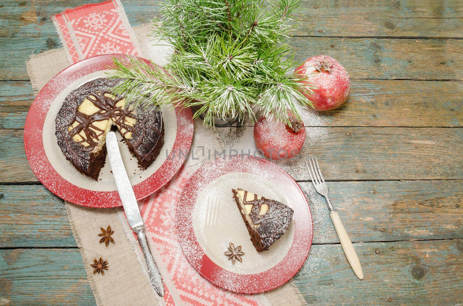 Still life with chocolate cake, Christmas tree and pomegranate by zimages