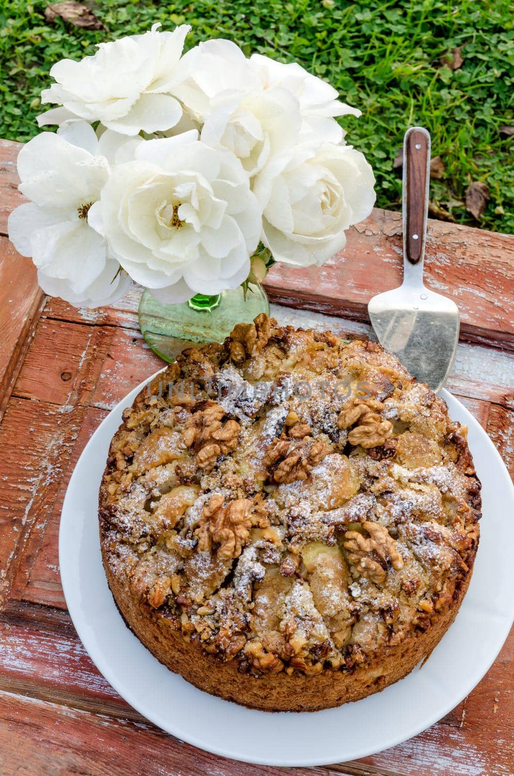 Autumn still life with cake, walnuts, apples and white roses. Rustic style. From series Natural organic food