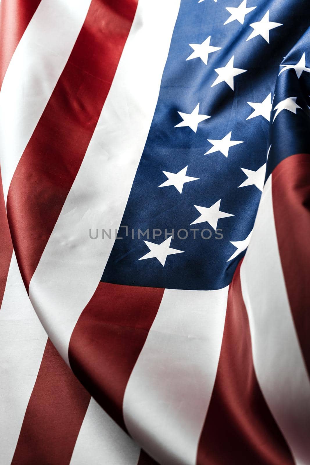 Beautifully waving star and striped American flag. creative photo.