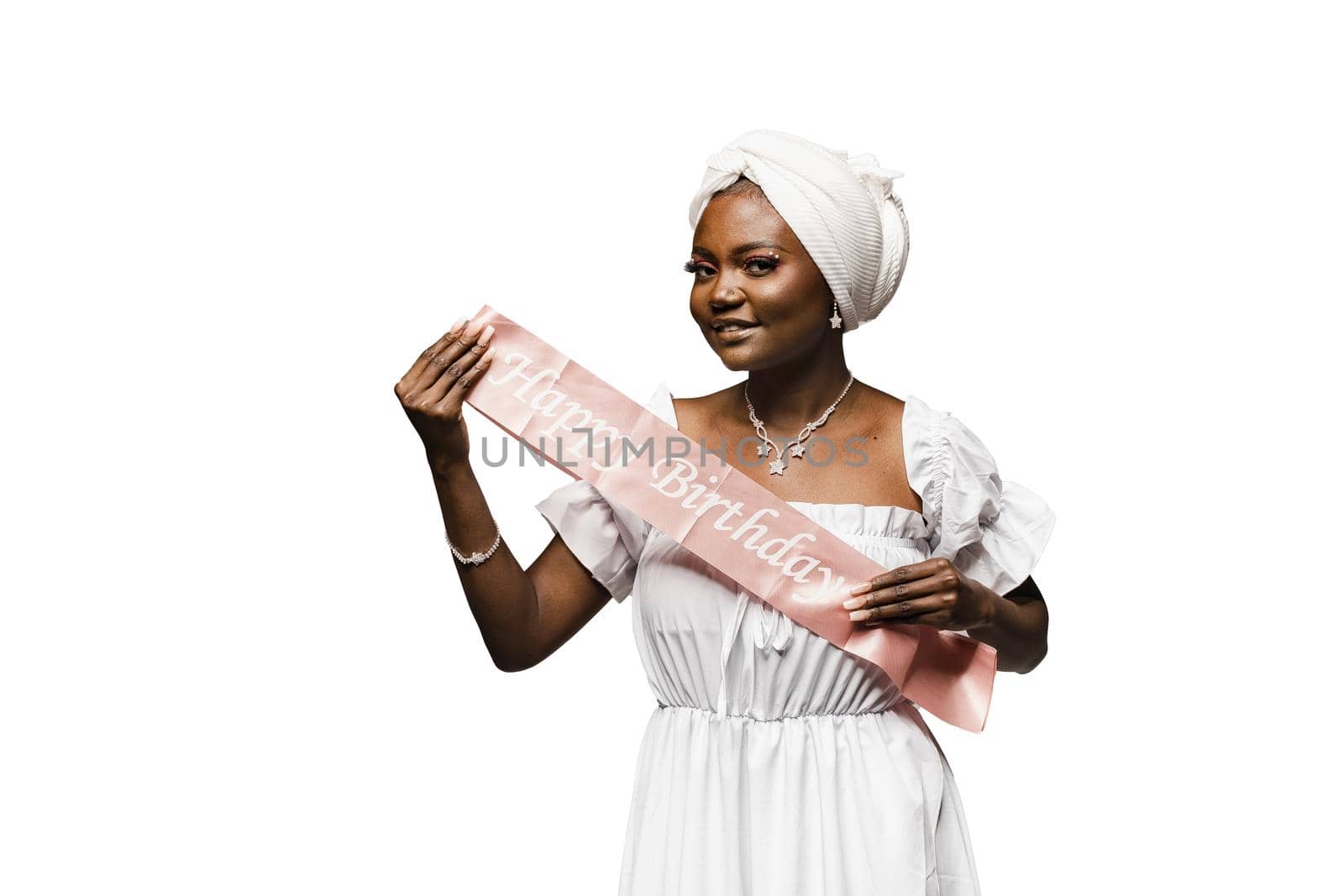 Happy muslim woman with birthday ribbon on white background. Black african woman is celebrating her birthday. by Rabizo