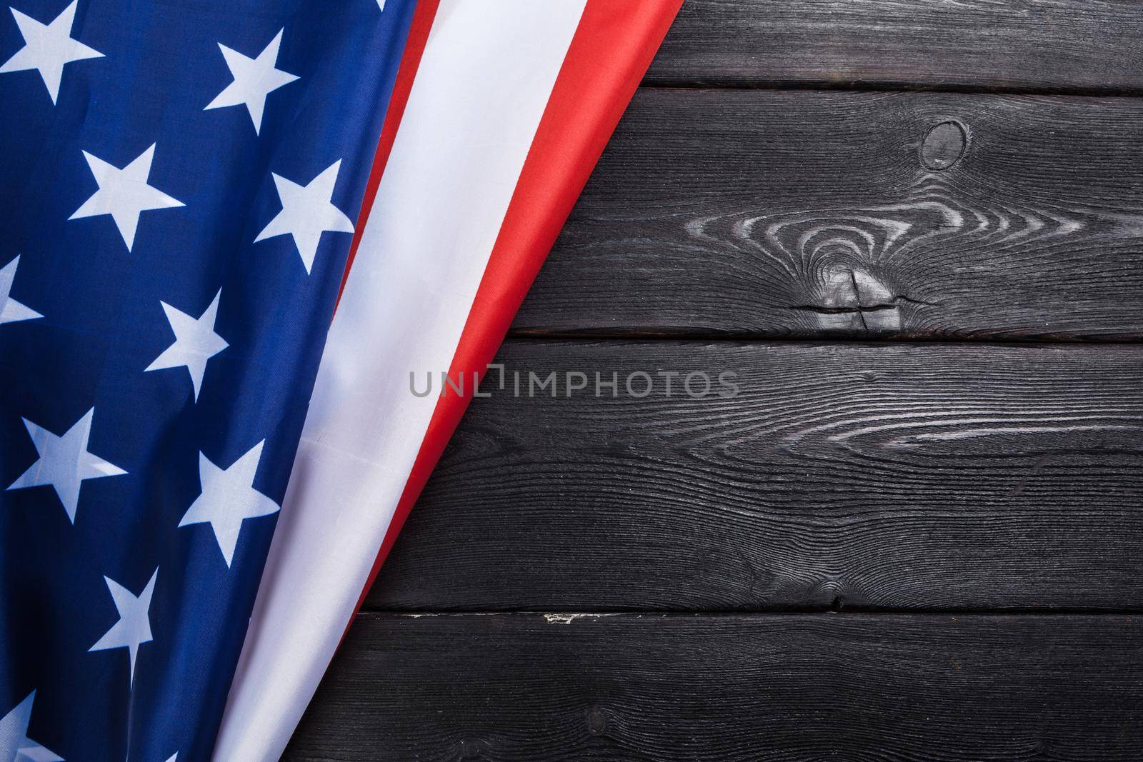 USA flag on dark wooden table background. creative photo.