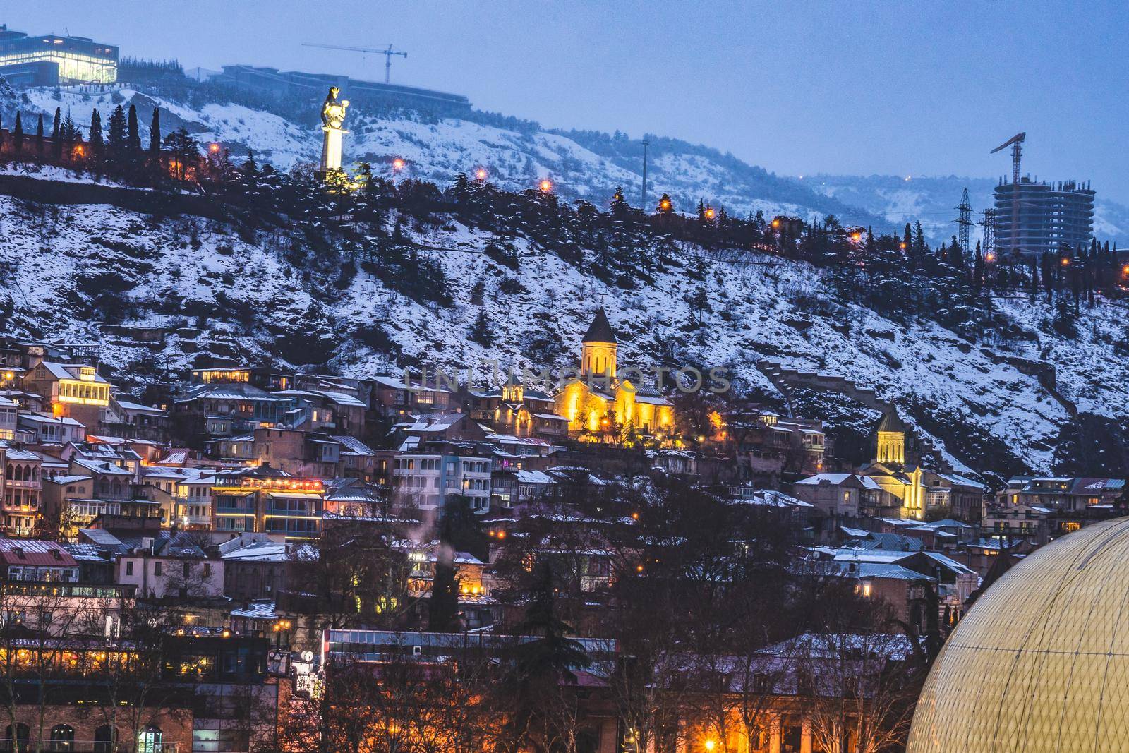 Snowing in Tbilisi city in the evening by Elet