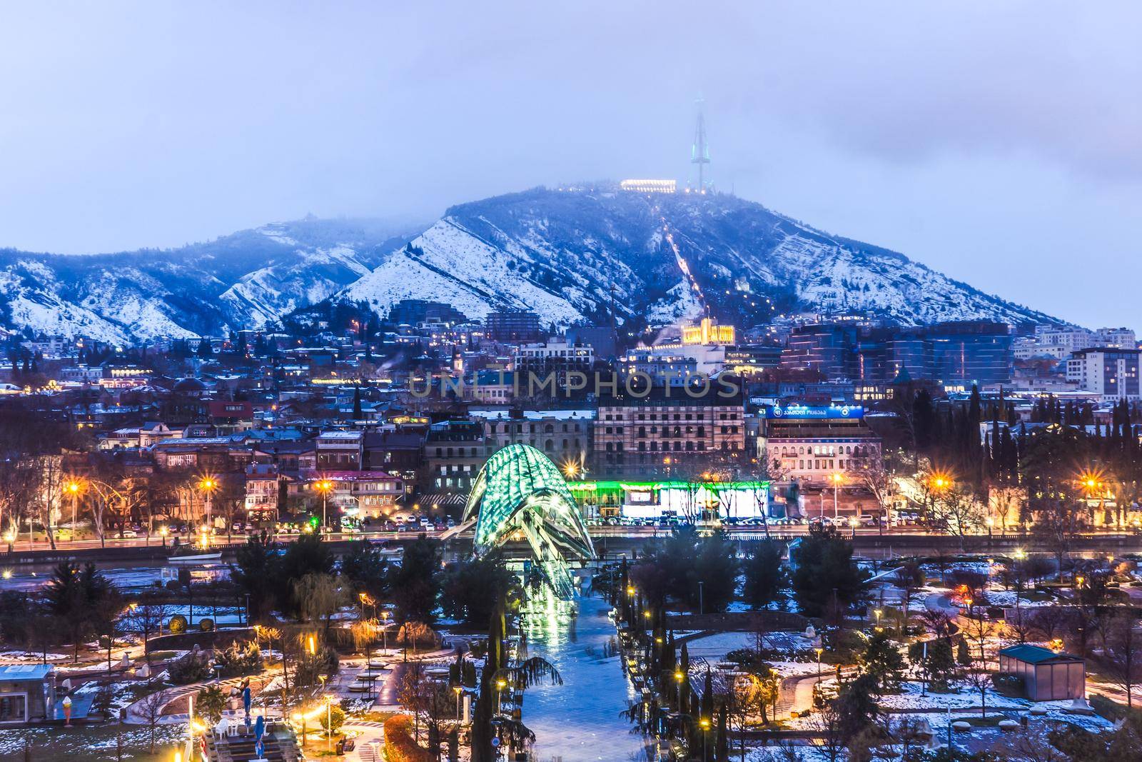 Snowing in Tbilisi city in the evening by Elet