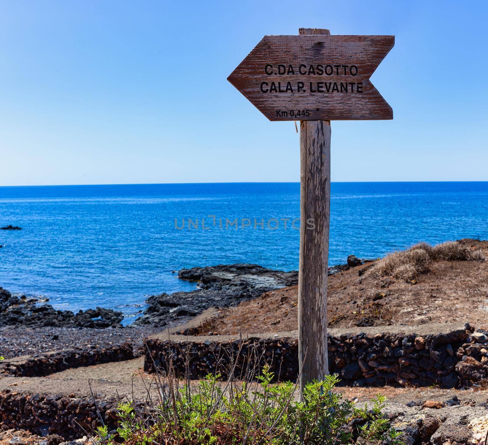 Old wooden road signs indicating the direction for the beach by bepsimage