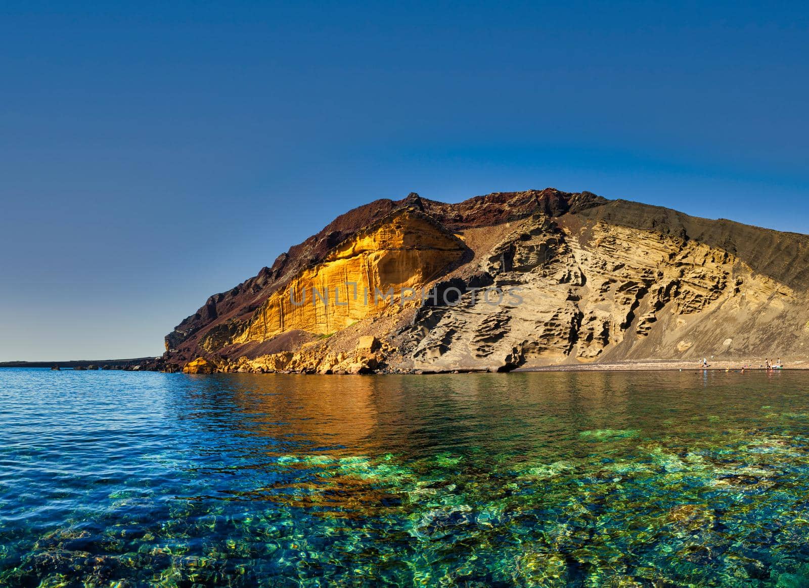 The Linosa volcano called Monte Nero in the beach of Cala Pozzolana di Ponente, Sicily by bepsimage