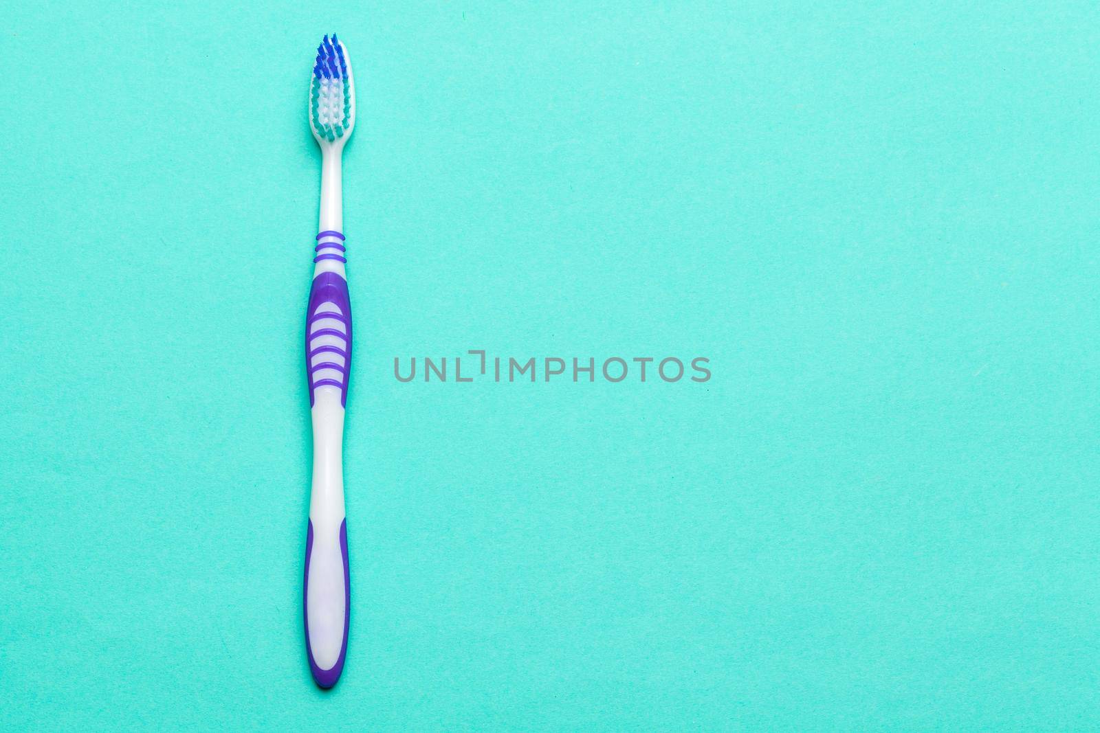 Toothbrushes on blue background. Close up.