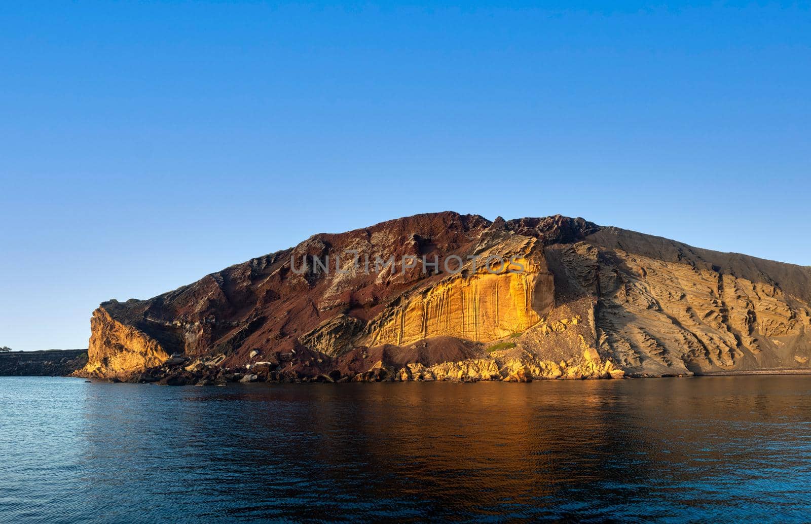 View of the Linosa volcano called Monte Nero in the beach of Cala Pozzolana di Ponente, Sicily