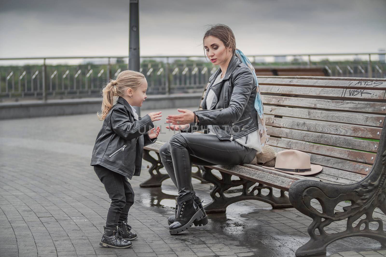 mother and daughter on a bench by zokov