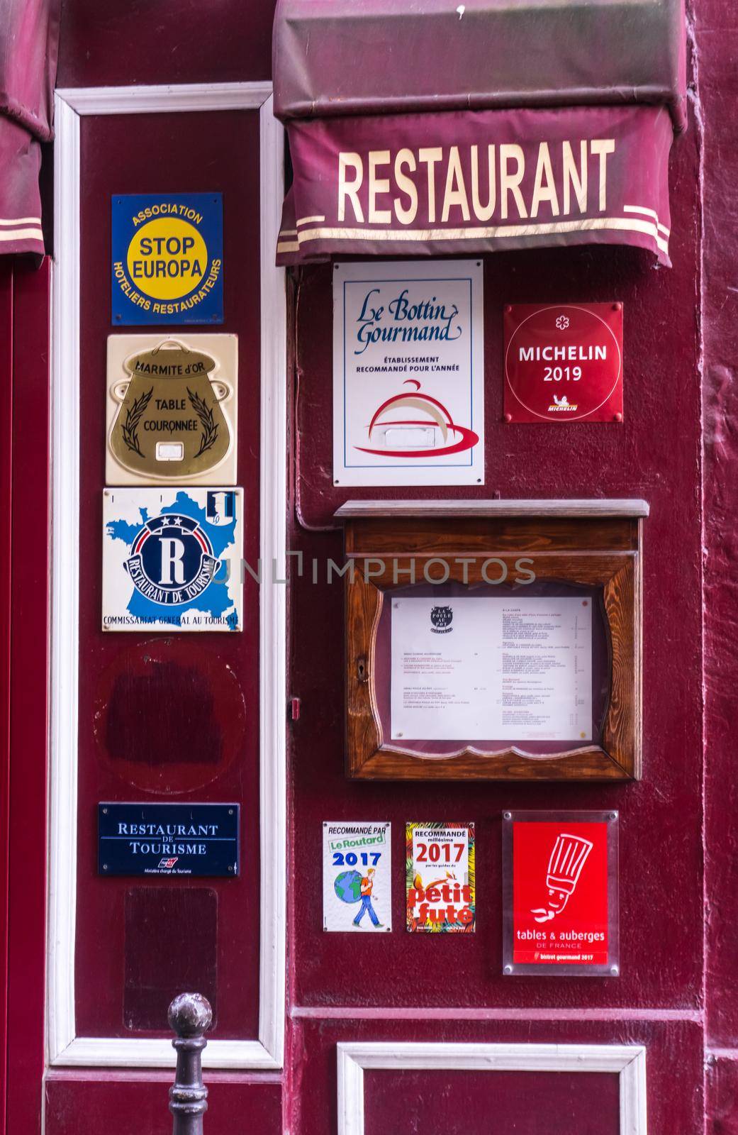 Bright cherry facade of a traditional French cuisine establishment, Paris