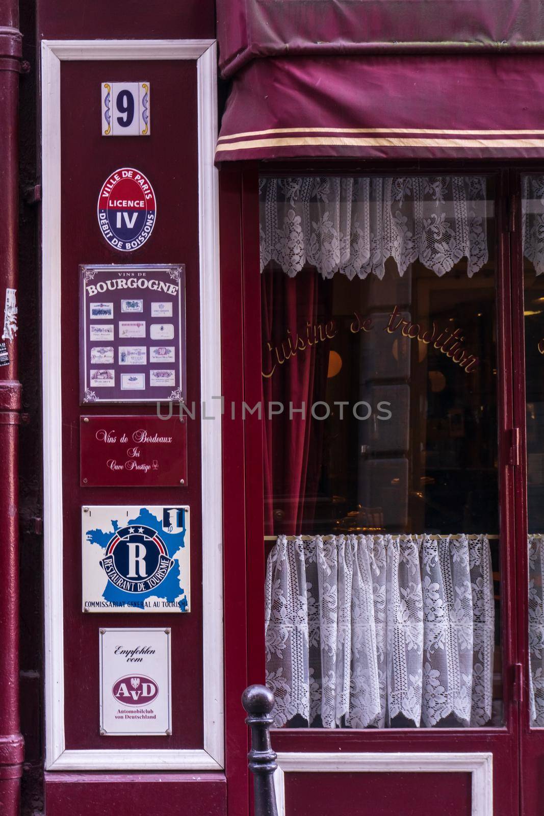 Bright cherry facade of a traditional French cuisine establishment, Paris
