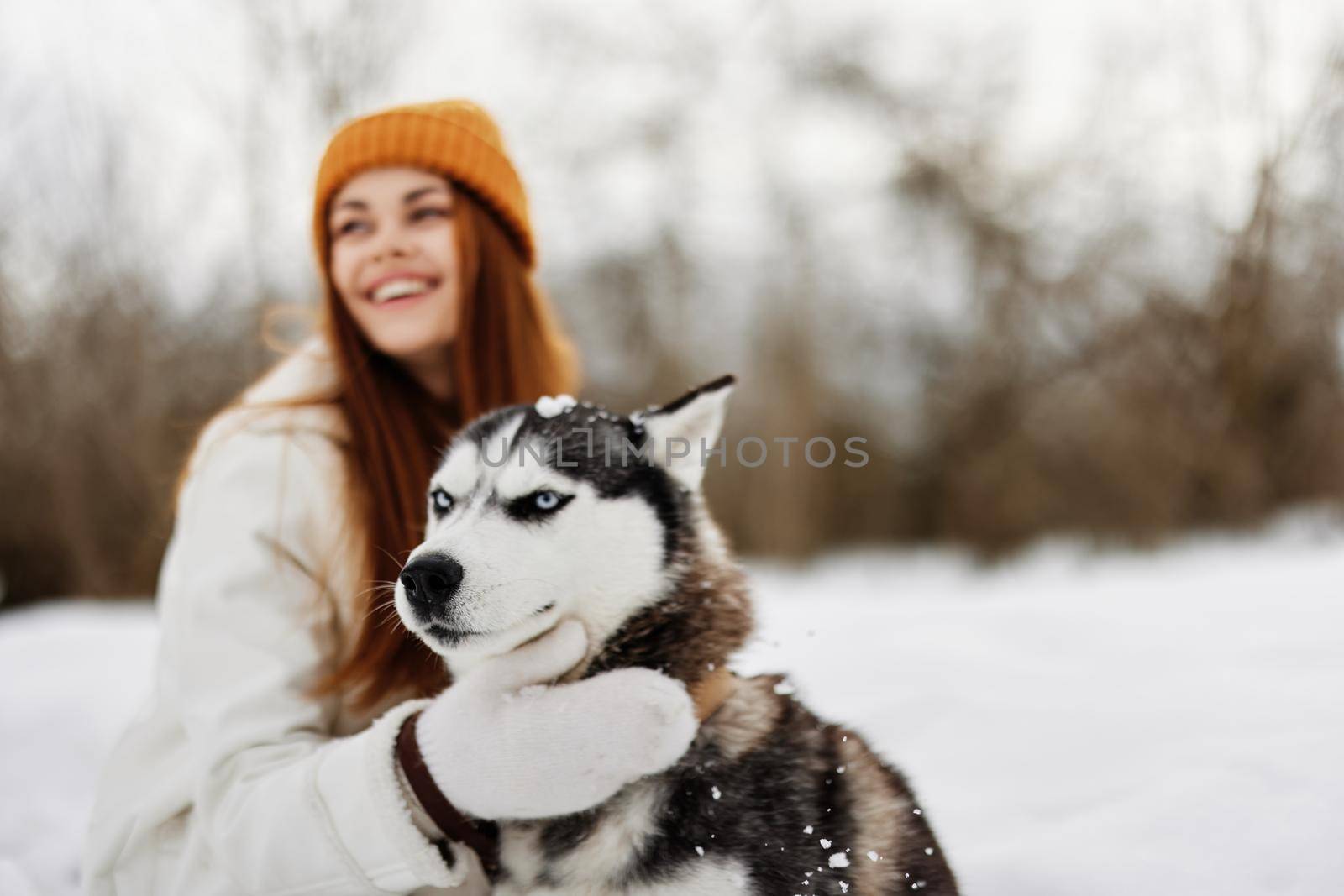 woman with dog on the snow walk play rest Lifestyle by SHOTPRIME