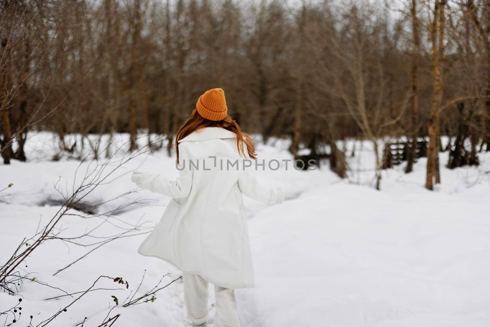 young woman Walk in winter field landscape outdoor entertainment There is a lot of snow around. High quality photo