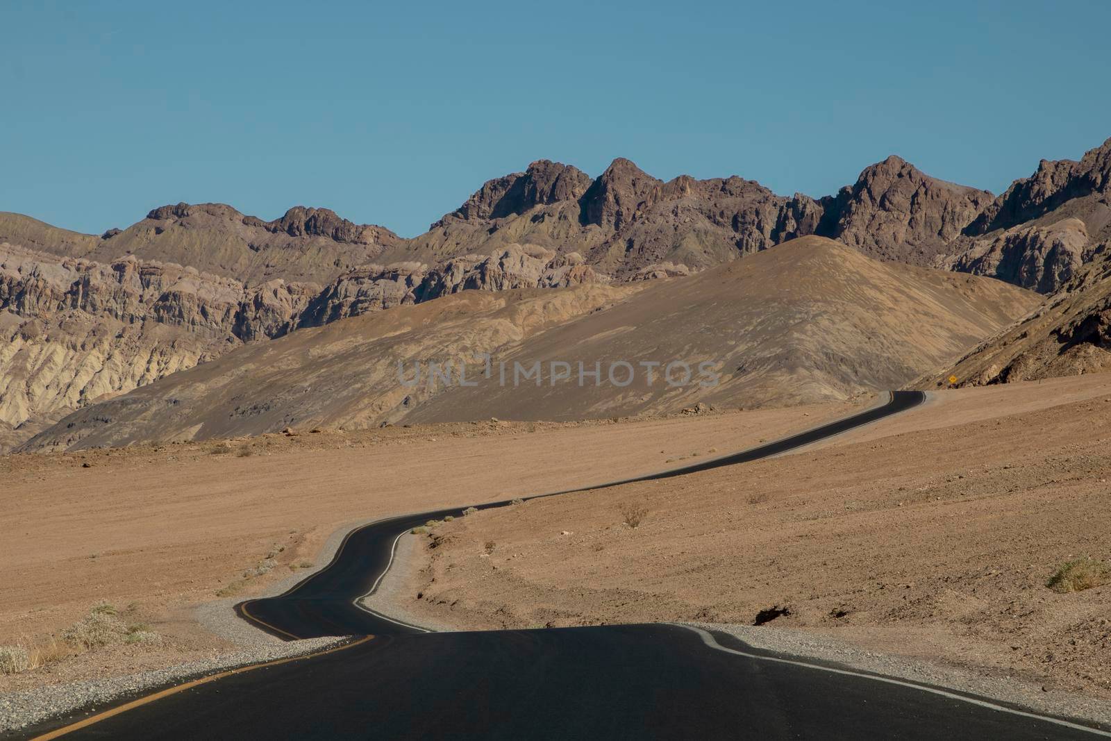 Curved road in the desert in Death Valley in the USA