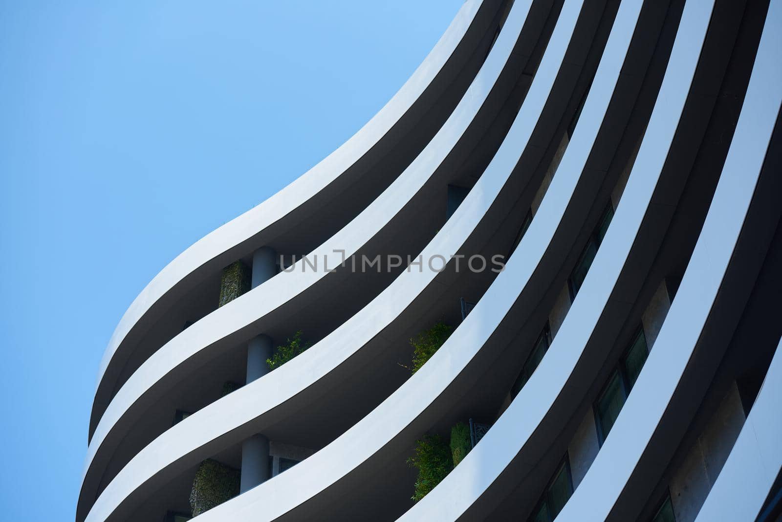 Modern apartment building in europe with plants.