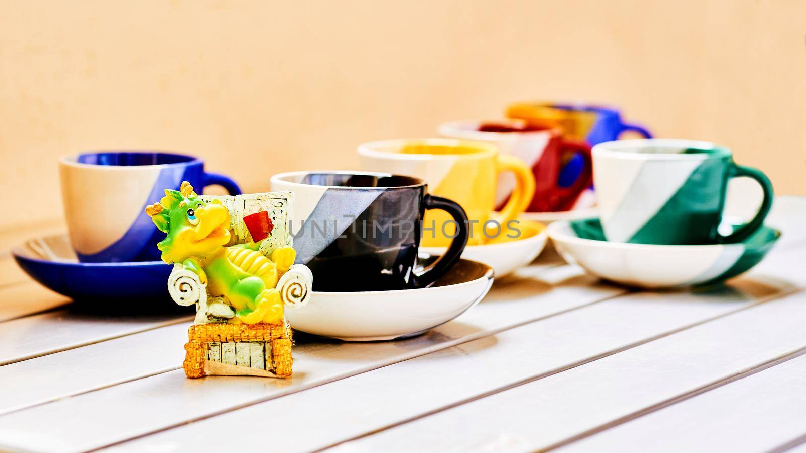 Green crocodile imp drinks coffee and tea coffee cups with saucers by jovani68