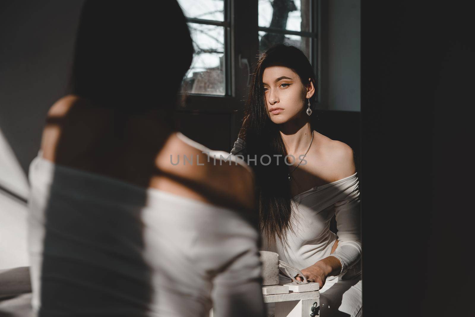 portrait of beautiful gentle woman in a white bodysuit posing in the sunshine. Black long hair. sensuality and tenderness by Ashtray25