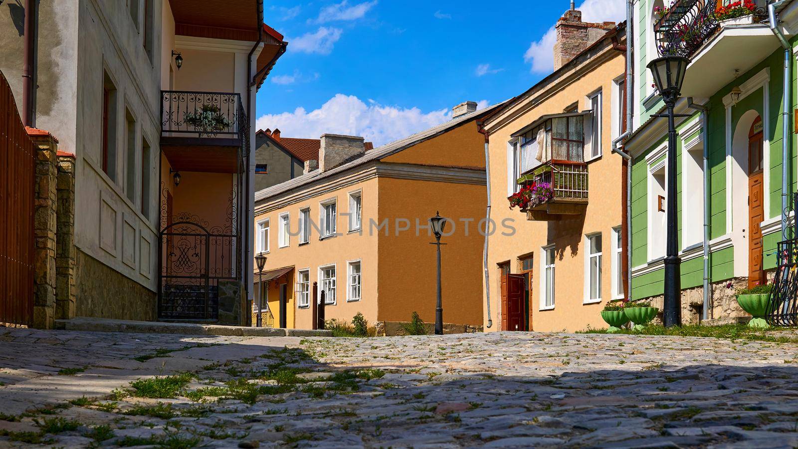 a public road in a city or town, typically with houses and buildings on one or both sides.