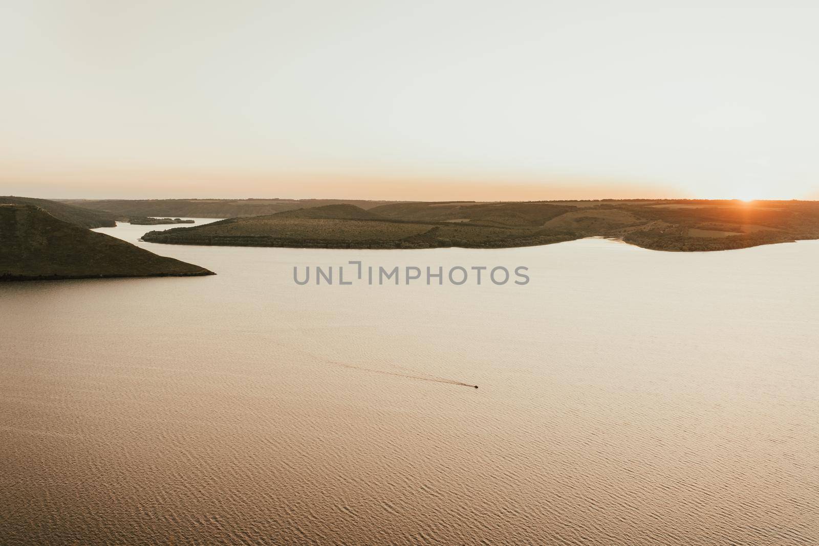 Islands in middle of the sea at sunset