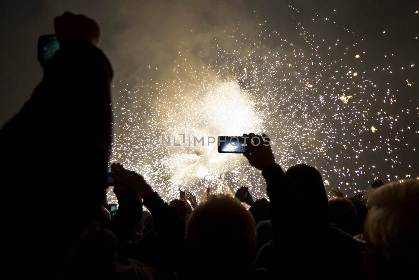 A person films the Cavallo di fuoco in Italy with their phone by ChrisWestPhoto