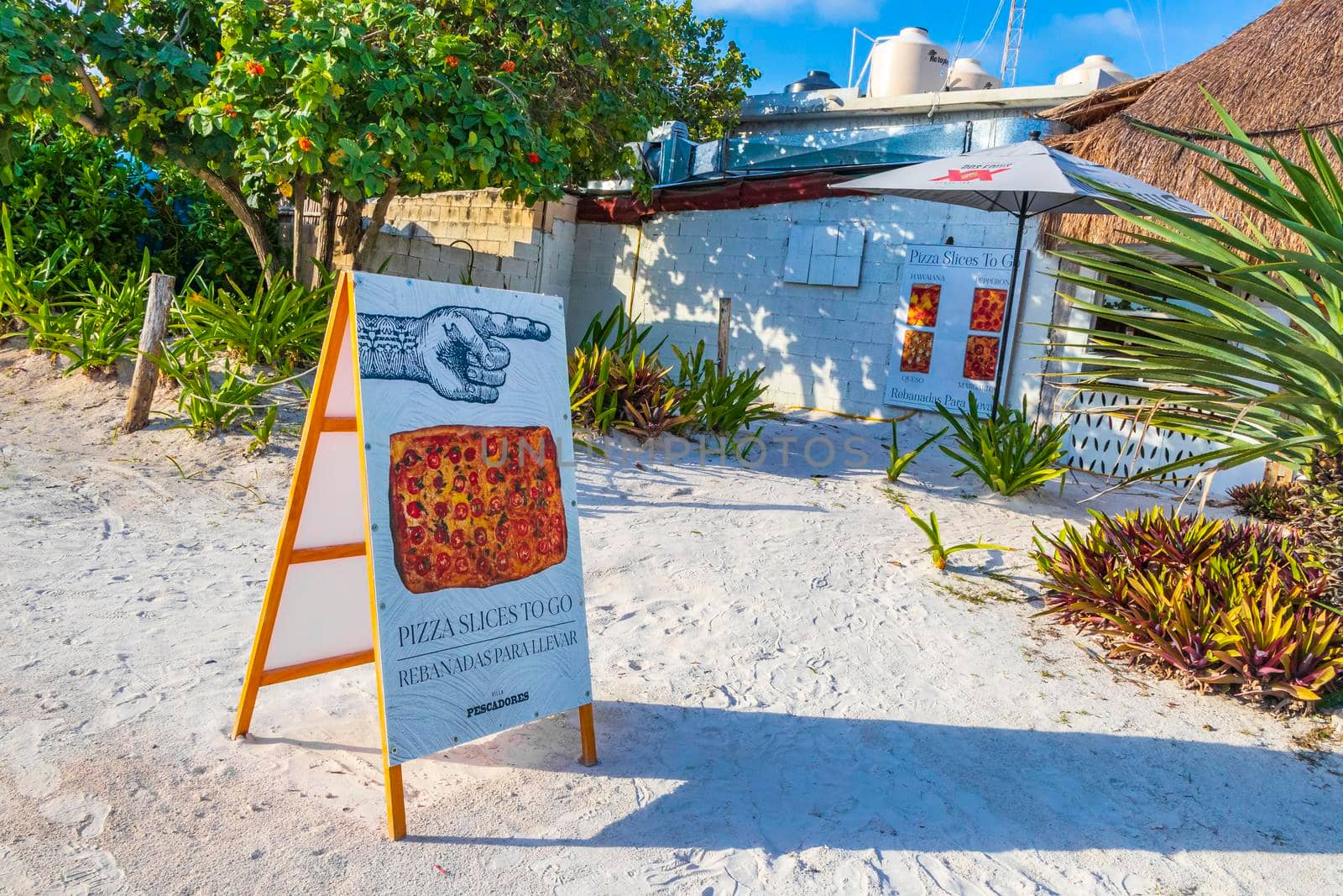 Buy pizza at caribbean coast and beach panorama Tulum Mexico. by Arkadij