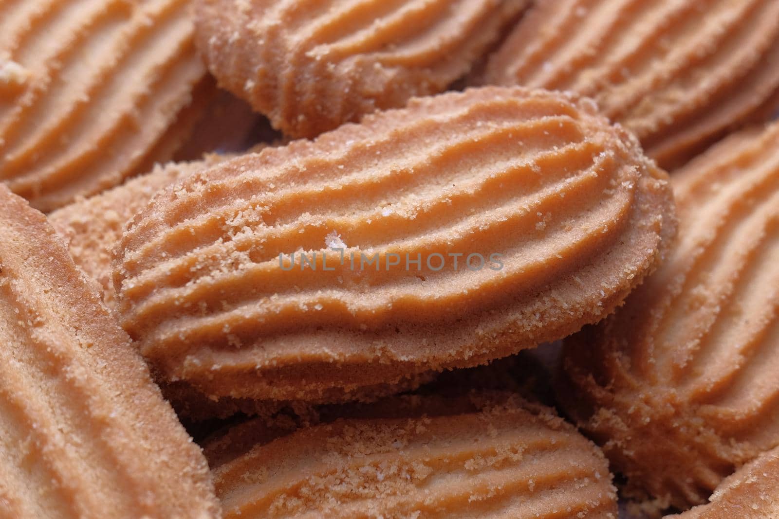 close up of sweet cookies on wooden table .